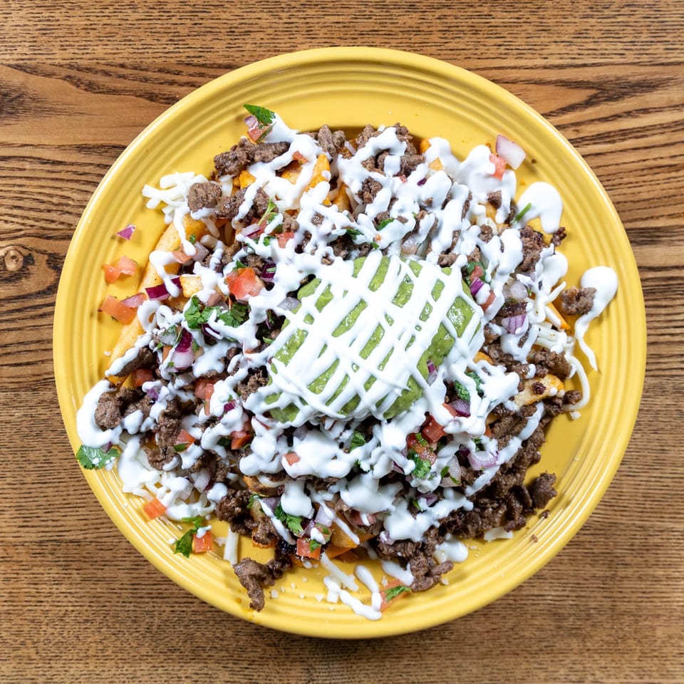 Fairweather's loaded fries with ground beef, cheese, sour cream, guacamole, and pico de gallo.